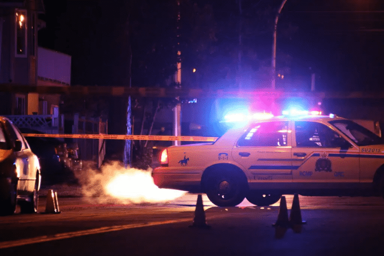 Surrey RCMP patrol car at night securing the scene of a double shooting in Fraser Heights.